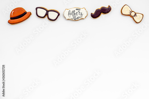 bow tie, moustache, glasses and hat for Happy Father Day party on white background top view copy space