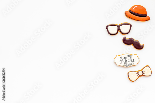 bow tie, moustache, glasses and hat for Happy Father Day party on white background top view copy space