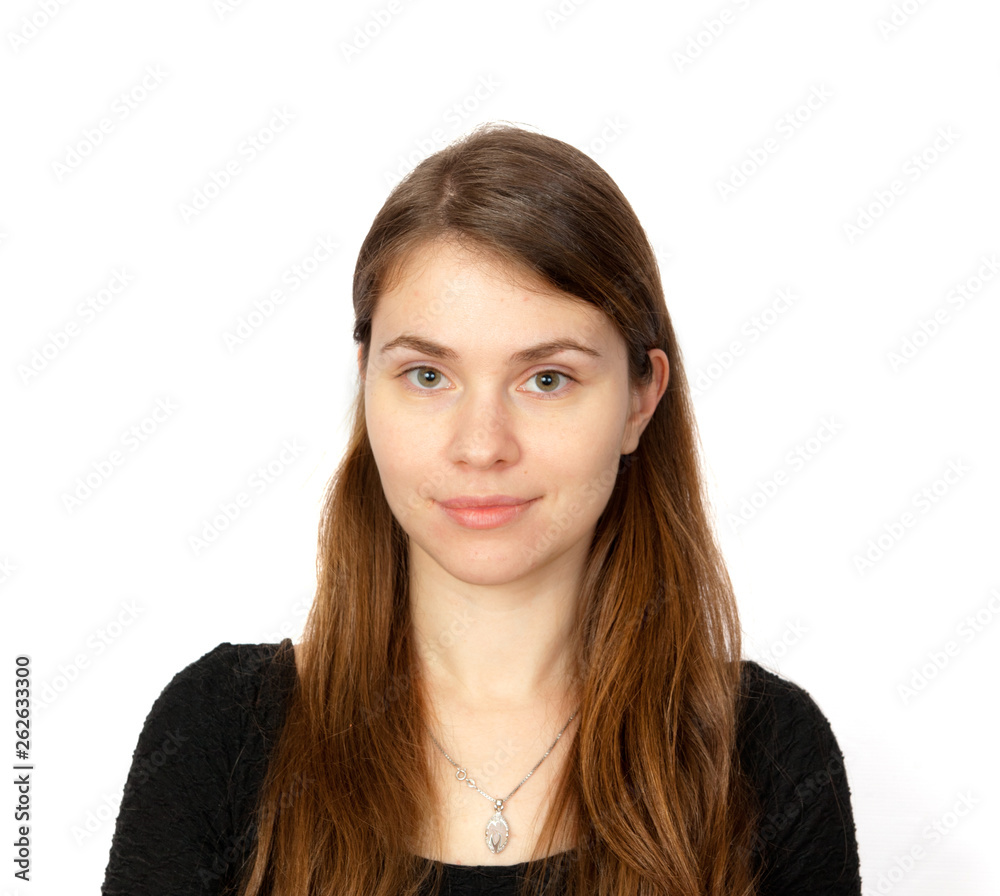 Brown-haired young woman smiles on white background Brown-haired young woman smiles on white background