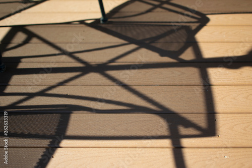 Porch Shadows of Table and Chairs