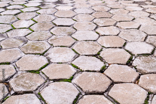 hexagon shaped tile paved sidewalk with perspective view. background, urban.