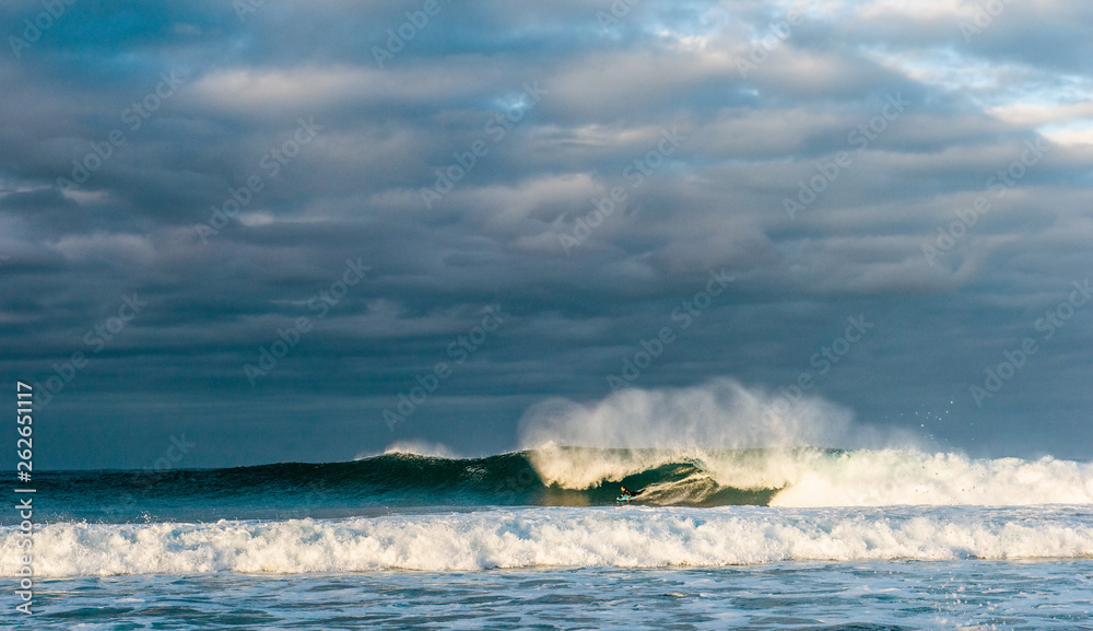 Fototapeta premium Powerful ocean wave breaks on a shallow bank. Stormy weather. Seascape.