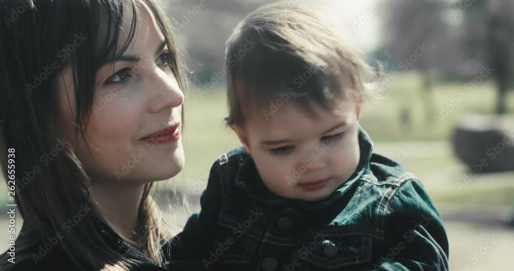 Portrait of a mother together with her baby daughter. Cinematic 4K footage. Portrait of a mother together with her baby daughter. Cinematic 4K footage.