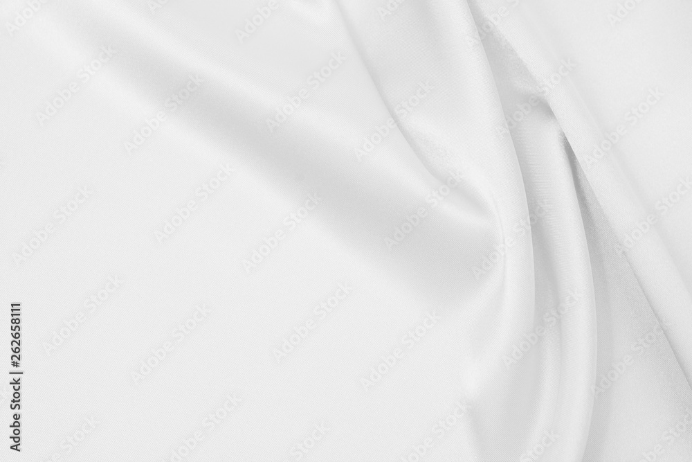 Fototapeta premium The texture of the satin fabric of white color for the background 