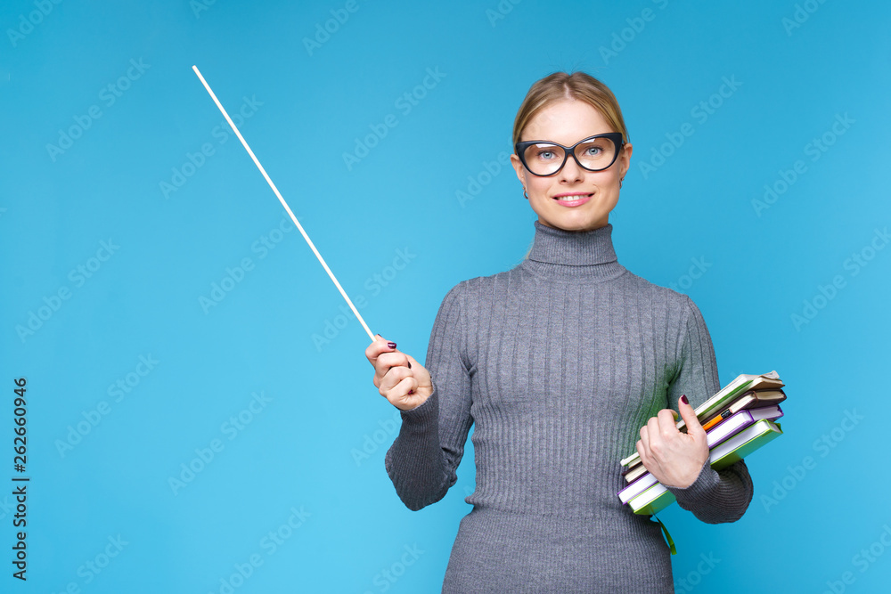 Photo of woman teacher in glasses with pointer and books Photo of woman teacher in glasses with pointer and books