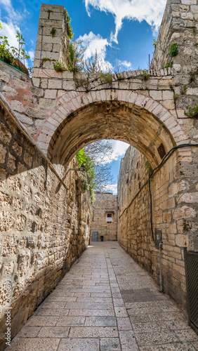 Ancient narrow street in old city of Jerusalem that is considered holy to the three major religions — Judaism, Christianity, and Islam, Israel