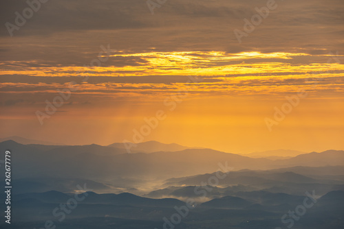 Beautiful mountain and morning sunrise over the sea of mist. Mon Sone View point , Doi Pha Hom Pok National Park in Chiang Mai,Thailand.