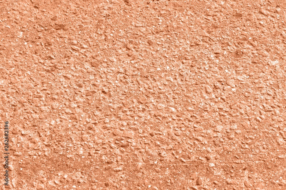 Old asphalt surface texture background close up. Orange color toned Old asphalt surface texture background close up. Orange color toned