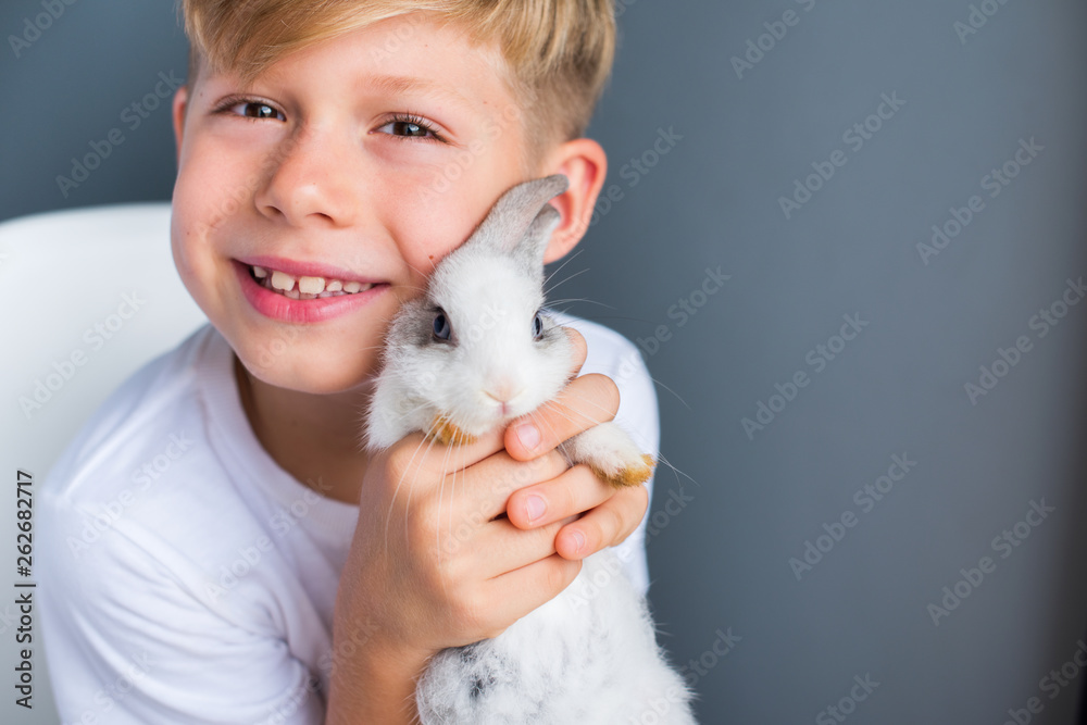 Little boy white Tshirt and tame dwarfish rabbit Little boy white Tshirt and tame dwarfish rabbit