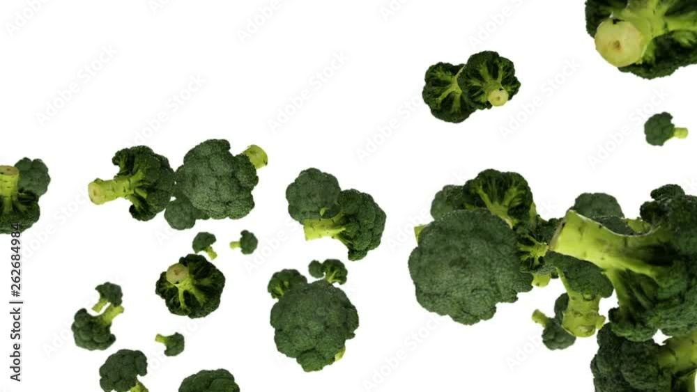 Broccoli flying in slow motion, against white