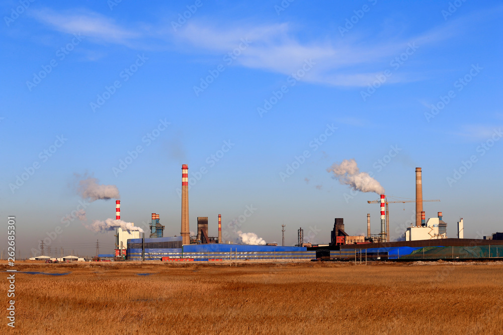 A chemical plant against a blue sky