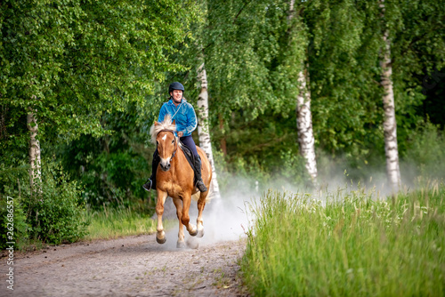 Woman horseback riding