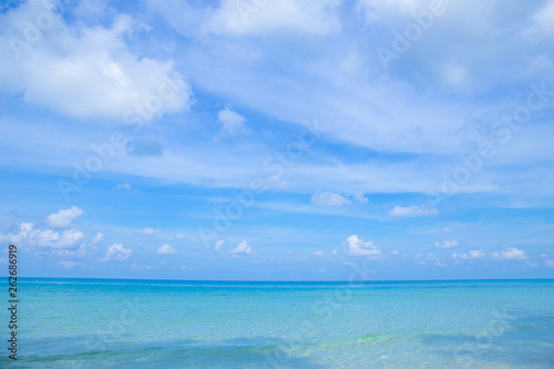 The beauty of the summer beach and the clear sea on the bright sky.