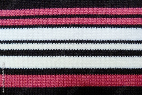 striped knitted knitted closeup background black red white