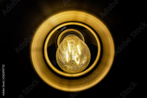 Close up incandescent lamp shining  Yellow light of lamp hang on ceiling