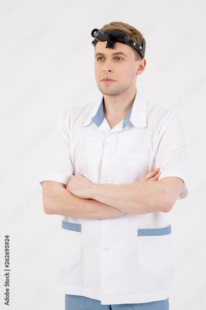 Portrait smiling otolaryngologist doctor with medical mirror on head isolated on white Portrait smiling otolaryngologist doctor with medical mirror on head isolated on white