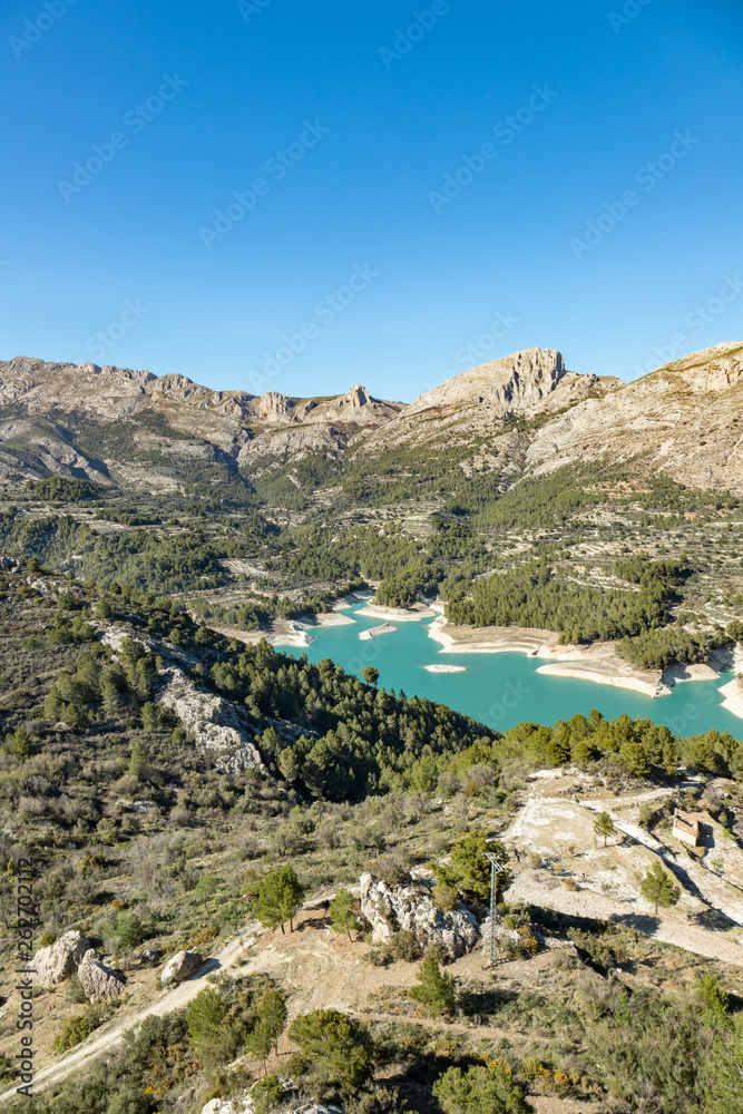 Wild nature with blue waters mountains and river near the castle of Guadalest in Alicante, Spain
