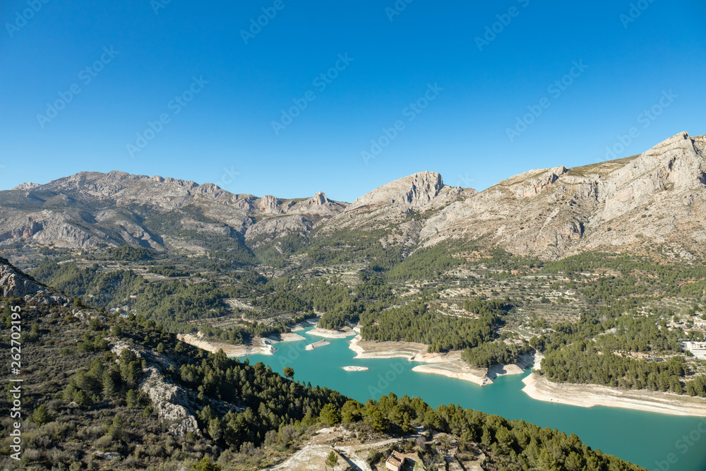 Obraz premium Wild nature with blue waters mountains and river near the castle of Guadalest in Alicante, Spain