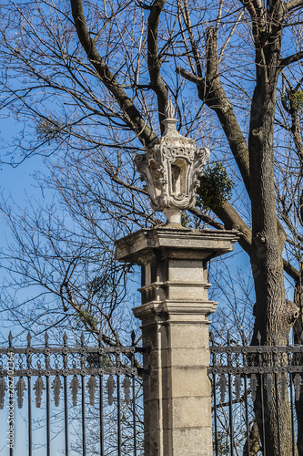 Double parade gate with baroque pediment and figures of saints to Lviv Greek Catholic Archbishop's Cathedral of Saint George (Ukr: Sobor sviatoho Yura, 1760). Lviv, Ukraine. photo