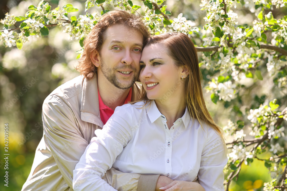 Fototapeta premium Young couple embracing smiling