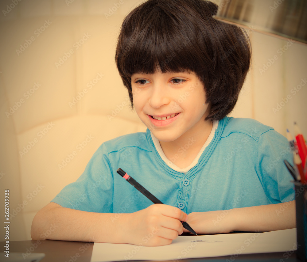 smiling child doing homework with computer smiling child doing homework with computer