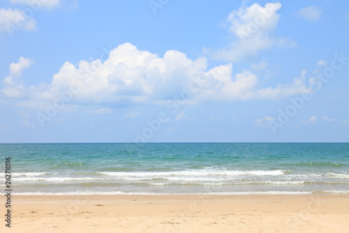 Sunny day at the beach with bright blue sky and fluffy white cloud on the sea horizon with copy space © Akarawut