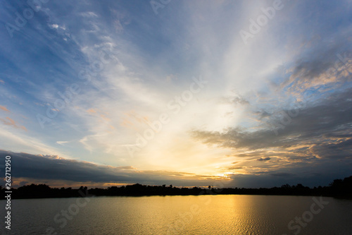 colorful dramatic sky with cloud at sunset.