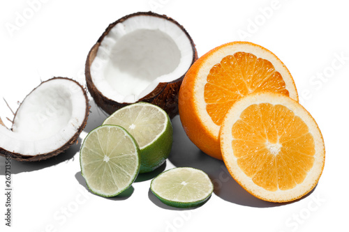 Fresh juicy orange, coconut and green lime isolated on white background. Concept of Healthy eating and dieting. Travel and holiday concept