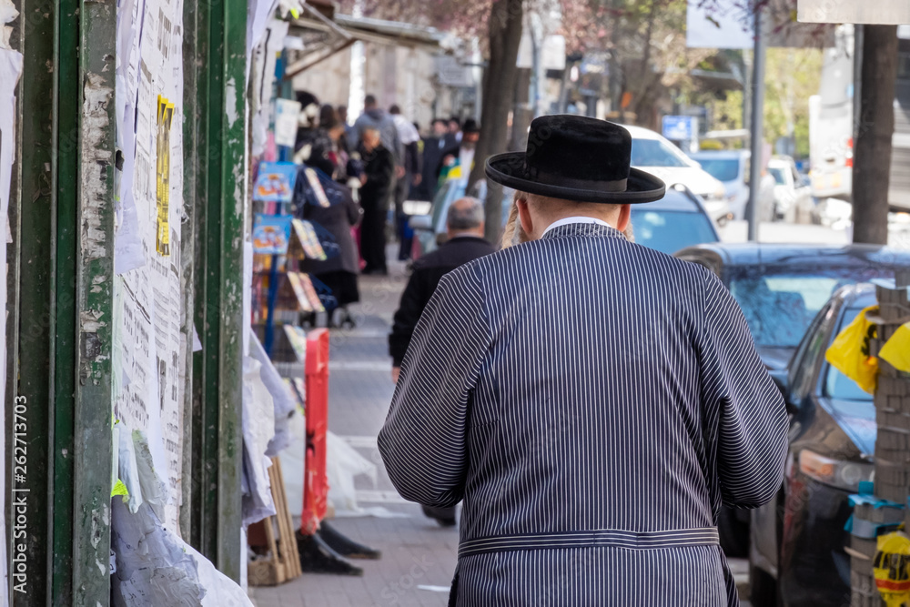 Undefined ultra-orthodox jewish person walk in jewish quarter. Jerusalem. Israel