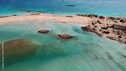 Stunning aerial of surfer paragliding at this island paradise of Elafonissi beach Crete, Greece photo