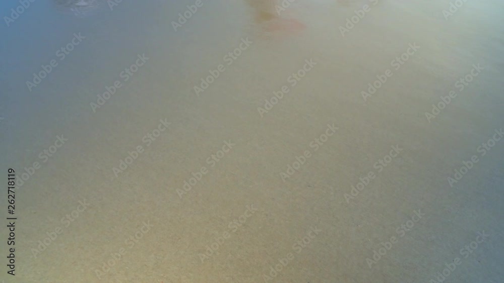 Amazing white sand covered with turquoise waves. Ocean waves at sunset time. Amazing white sand covered with turquoise waves. Ocean waves at sunset time.