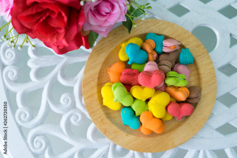 stack of macaron heart shape dessert on woodent plate stack of macaron heart shape dessert on woodent plate