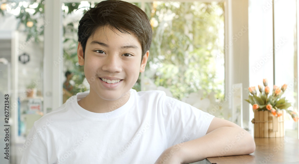 Portrait of asian smiling teen boy. Medium shot of handsome guy. Portrait of asian smiling teen boy. Medium shot of handsome guy.