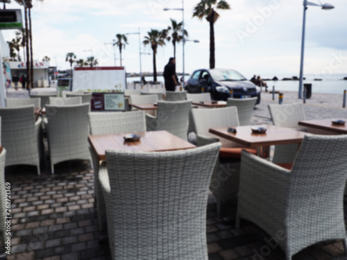 Street cafe and restaurant table and chair in Capri Island town in Italy at Naples. Landscape with Cafeteria at Italian coast. Anacapri in Europe. View in summer. Amalfi scenery