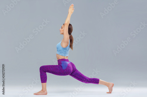 Young girl doing yoga, studio