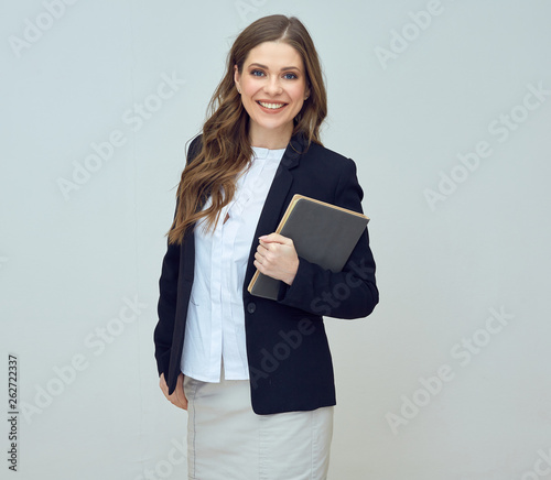 smiling woman teacher holding book
