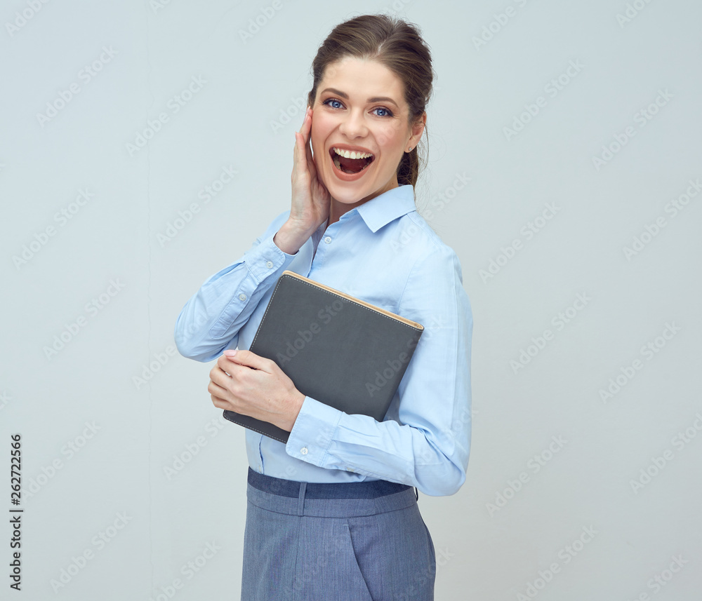 happy woman wearing blue shirt holding book. happy woman wearing blue shirt holding book.