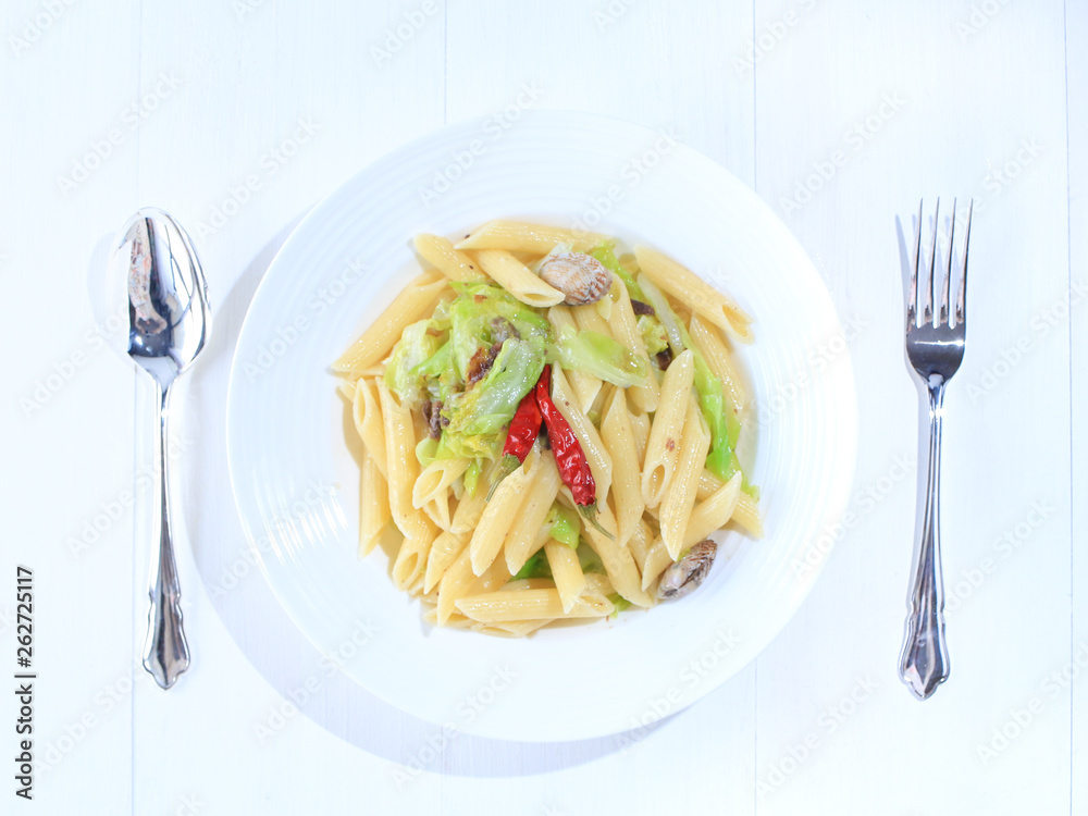 Penne pasta with anchovy and spring cabbage and shells アンチョビと春キャベツのペンネパスタ Stock Photo Adobe Stock