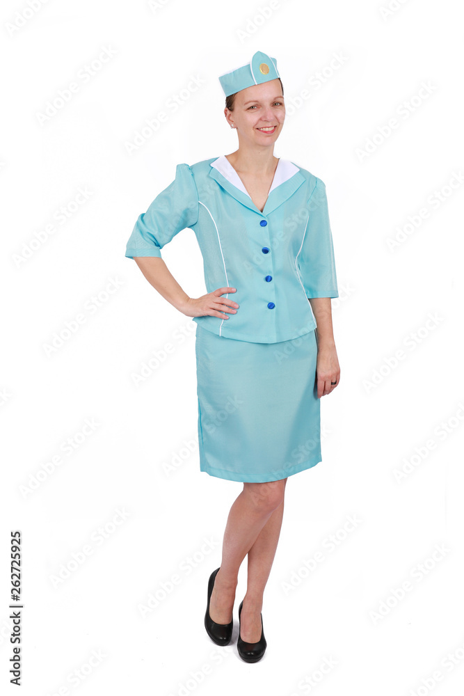 Charming and smiling stewardess wearing in the blue uniform. Isolated on white background Charming and smiling stewardess wearing in the blue uniform. Isolated on white background