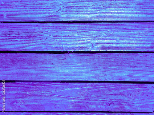 Painted in bright color boards on the fence.