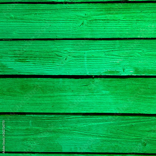 Bright green fence. Green fence boards the close-up