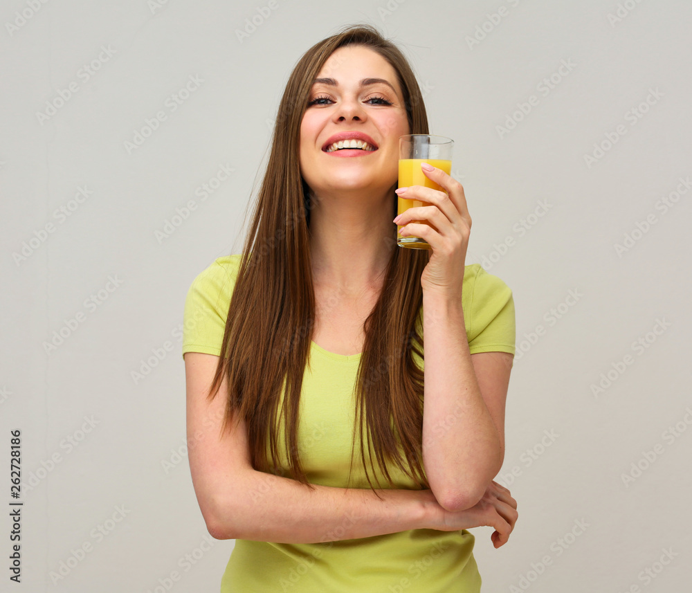 smiling woman holding orange juice glass. smiling woman holding orange juice glass.