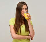 smiling woman drinking orange juice.