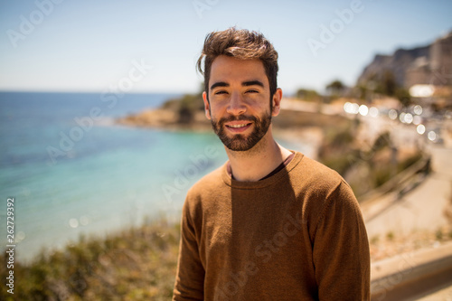young man happy in the beach