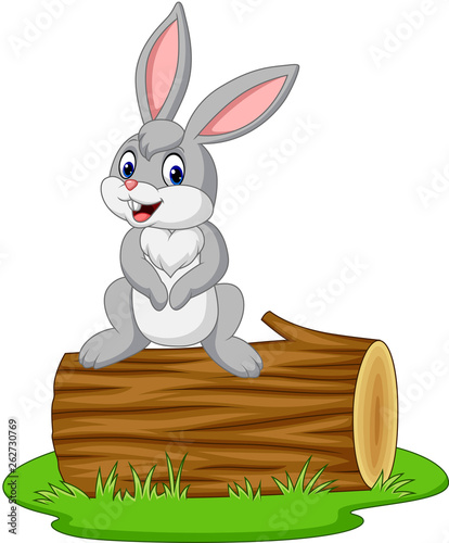 Cartoon rabbit sitting on a log