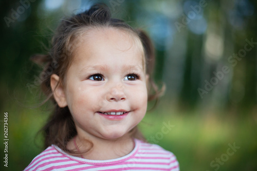 Lovely little girl outdoor portrait. Summertime, lifestyle