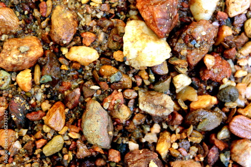 Texture of rough and wet stones of a river in its natural environment, in the external area of ​​a small farm in the city of Mairinque, São Paulo, Brazil.