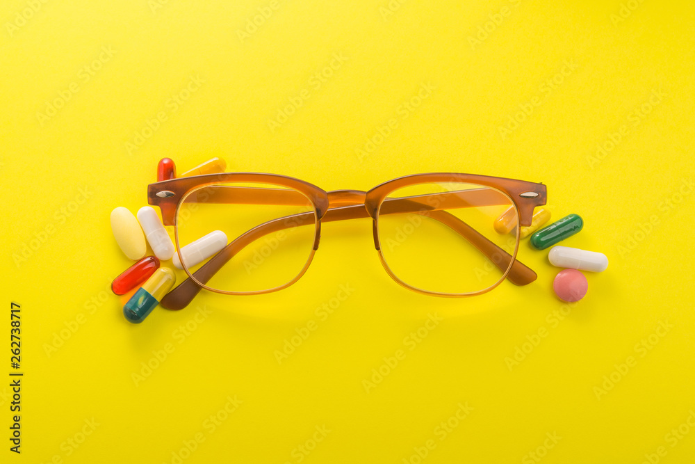 Old style glasses with vitamin and pills Old style glasses with vitamin and pills