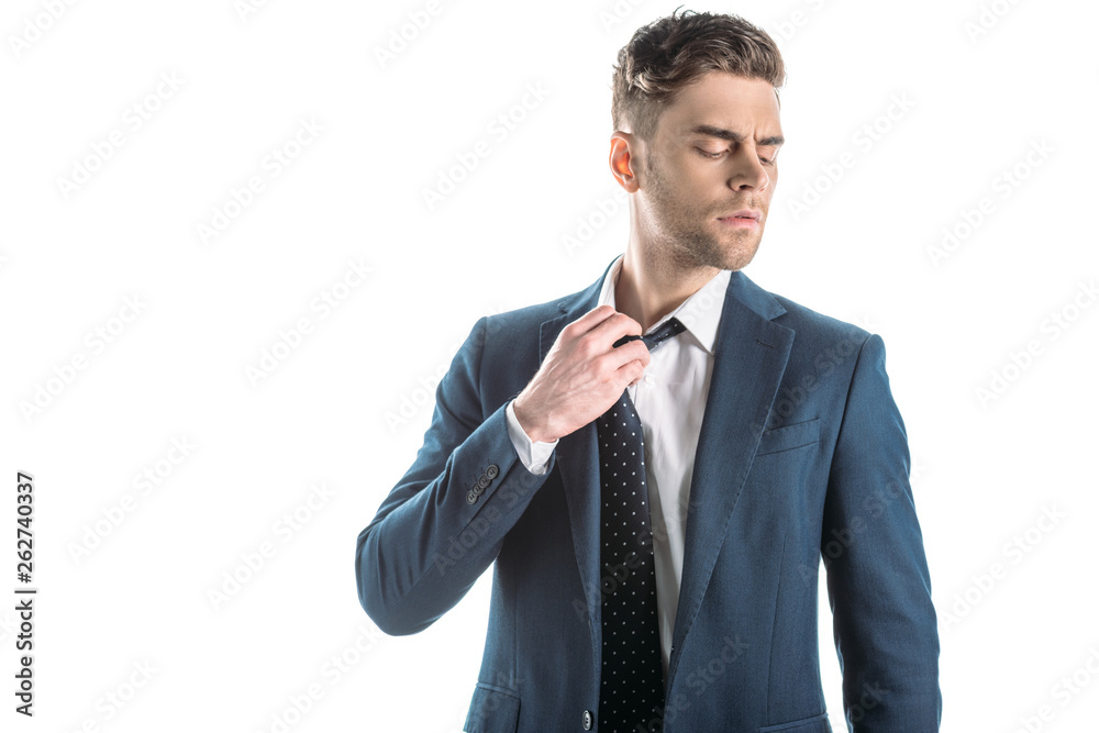 handsome businessman with closed eyes touching tie isolated on white handsome businessman with closed eyes touching tie isolated on white