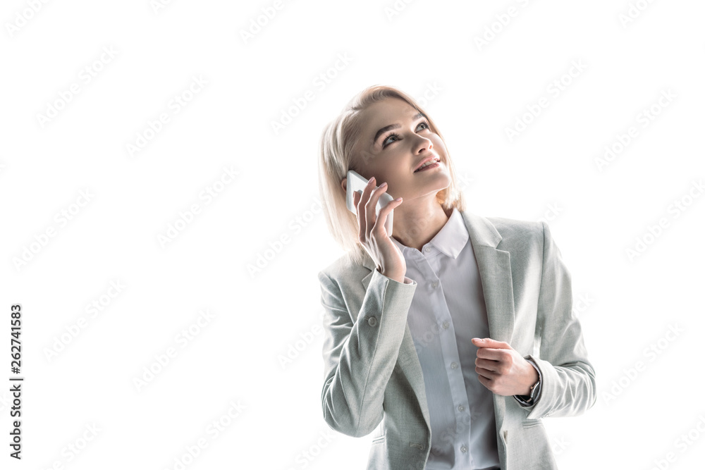 cheerful, pretty businesswoman talking on smartphone and looking up on white cheerful, pretty businesswoman talking on smartphone and looking up on white